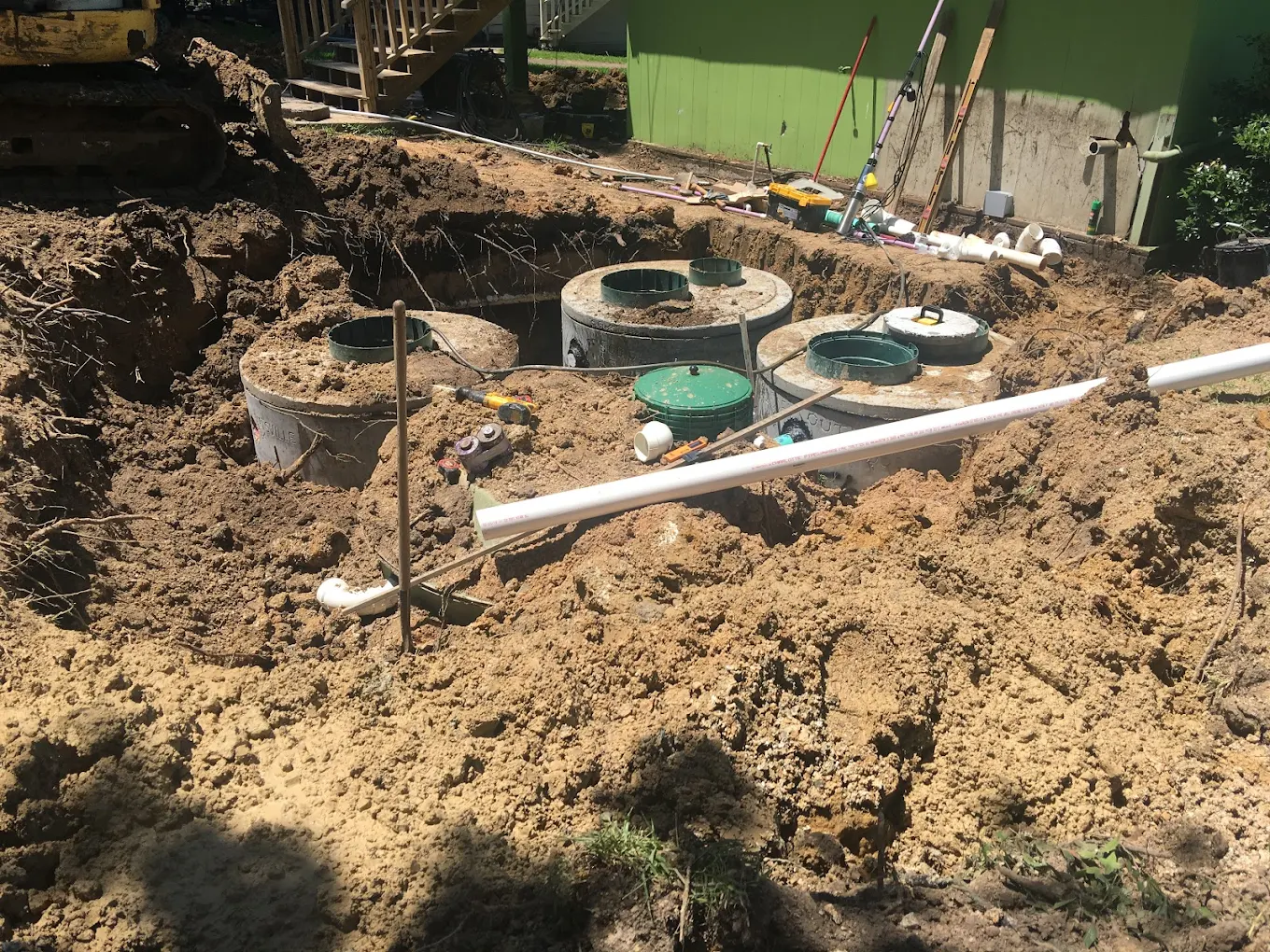 Active septic system installation with tanks, pipes, and components